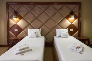 Postel nebo postele na pokoji v ubytování HOTEL ADRIANO
