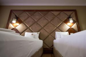 Postel nebo postele na pokoji v ubytování HOTEL ADRIANO
