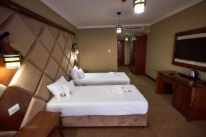 Postel nebo postele na pokoji v ubytování HOTEL ADRIANO