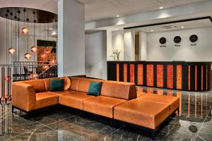 a couch in the lobby of a store at 1891 Garni Hotel in Krakow