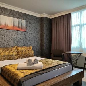 Ένα ή περισσότερα κρεβάτια σε δωμάτιο στο Zengin City Hotel