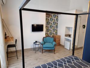 Televízia a/alebo spoločenská miestnosť v ubytovaní Cuore Mio B&b