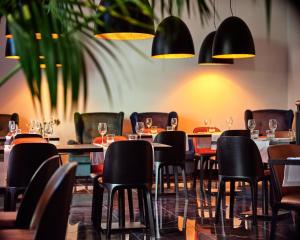 Reštaurácia alebo iné gastronomické zariadenie v ubytovaní 1891 Garni Hotel