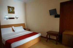 Ένα ή περισσότερα κρεβάτια σε δωμάτιο στο Hotel Filippo