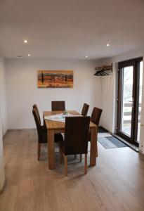 a dining room with a table and chairs at Haus Herrloch in Hermeskeil