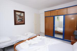 Ένα ή περισσότερα κρεβάτια σε δωμάτιο στο Nella Maisonette Hanioti
