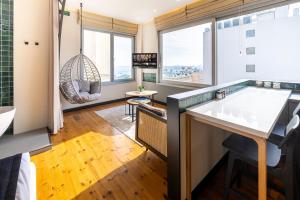 a bathroom with a hammock and a large window at Upside Apartments in Istanbul