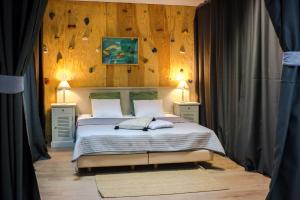 Cama ou camas em um quarto em Villa Lena