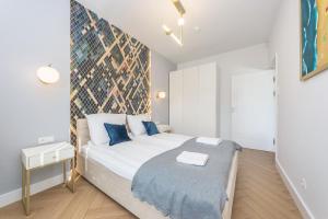 Posteľ alebo postele v izbe v ubytovaní Pomorskie Apartamenty Bernadowska Gold