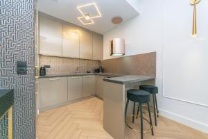 Kuchyňa alebo kuchynka v ubytovaní Pomorskie Apartamenty Bernadowska Gold