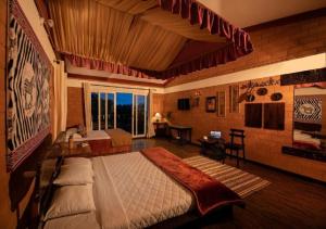 Postel nebo postele na pokoji v ubytování De Rock Jungle Living Resort + 37 fotografií