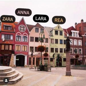 a group of buildings with different names on them at Apartmán Anna in Komárno