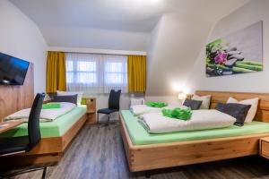 Llit o llits en una habitació de Hotel Seerose Lindau Bodensee