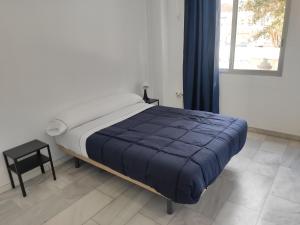 Кровать или кровати в номере Sunny Room plaza La Nogalera