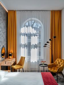 Posteľ alebo postele v izbe v ubytovaní 1891 Garni Hotel