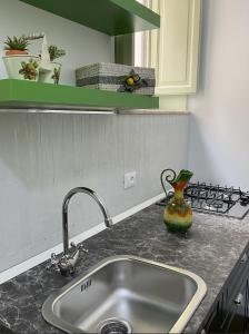 A kitchen or kitchenette at Il gallo di Eracle - Charming suites & rooms