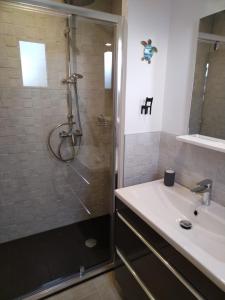 a bathroom with a shower and a sink at Studio in Challans