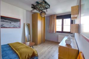 En eller flere senge i et værelse på Loft Gijón