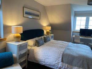 Postel nebo postele na pokoji v ubytování Macrae Croft- Rooms