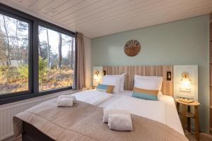 Postel nebo postele na pokoji v ubytování Center Parcs Vossemeren + 37 fotografií