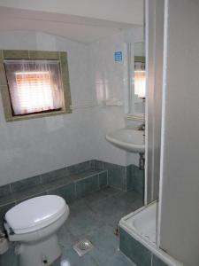 a bathroom with a toilet and a sink at Zora Holiday home in Beli