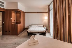 Ліжко або ліжка в номері BB Hotels Smarthotel Re Milano Nord