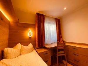 Letto o letti in una camera di Der Brückenhof Ramsau