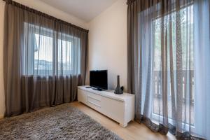 A television and/or entertainment centre at Plose 35