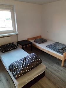 Postel nebo postele na pokoji v ubytování Villa Park Leśna
