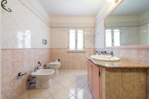 Kúpeľňa v ubytovaní Appartamento in Villa Gelsomino
