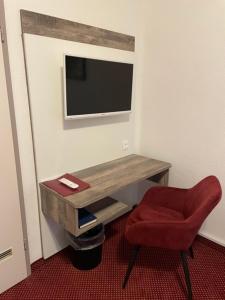 TV a/nebo společenská místnost v ubytování Hotel Germania