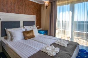 Кровать или кровати в номере Balneo Hotel Zsori Thermal & Wellness