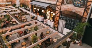 an overhead view of a restaurant with people sitting at tables at Draggo House - Premium Rooms - Old Town in Krakow