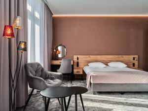 Posteľ alebo postele v izbe v ubytovaní 1891 Garni Hotel