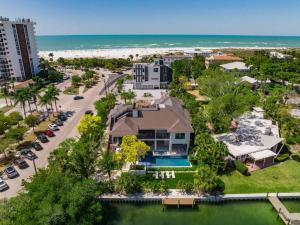 an aerial view of a house and the beach at The Ringling Estate in Sarasota