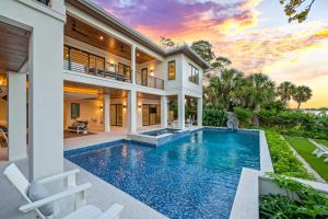 an exterior view of a house with a swimming pool at The Ringling Estate in Sarasota