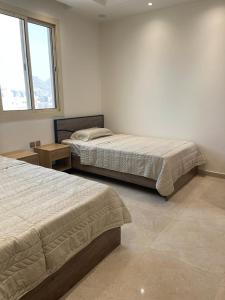Katil atau katil-katil dalam bilik di أفخم شقة فندقيه بالقرب من الحرم المكي