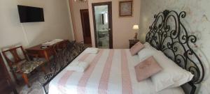 Ένα ή περισσότερα κρεβάτια σε δωμάτιο στο Tilde B&B