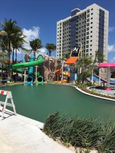 a water park with a slide in the water at Salinas Premium Resort in Salinópolis