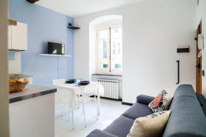 a living room with a couch and a table at Nel Cuore di Santa in Santa Margherita Ligure