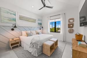 a white bedroom with a bed and a window at The Ringling Estate in Sarasota +66 photos