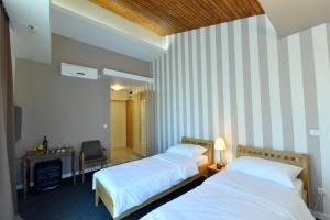 Postel nebo postele na pokoji v ubytování Villa Luxury Rooms - Wine Resort