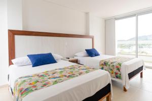 Hotel Santorini客房内的一张或多张床位