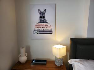 a bed room with a picture of a dog on a book at Ipswich Town Centre Apartment 5 in Ipswich