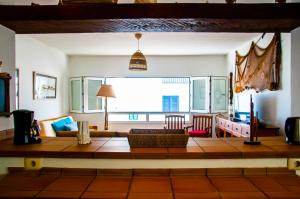 a living room with a couch and a table at Mareao FamaraBeach in Famara