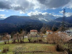 a view of a mountain from a field with a power line at Romantic Spa in Venas