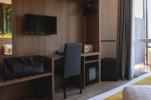 TV a/nebo společenská místnost v ubytování Hi Hotels Trento - Wellness & Spa Adults Only
