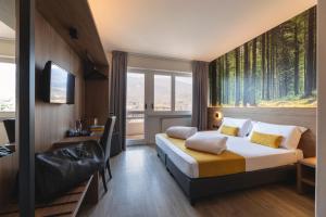 Postel nebo postele na pokoji v ubytování Hi Hotels Trento - Wellness & Spa Adults Only