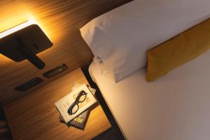 Postel nebo postele na pokoji v ubytování Hi Hotels Trento - Wellness & Spa Adults Only