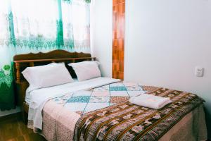 Cama o camas de una habitación en Hostal Mi Peru
